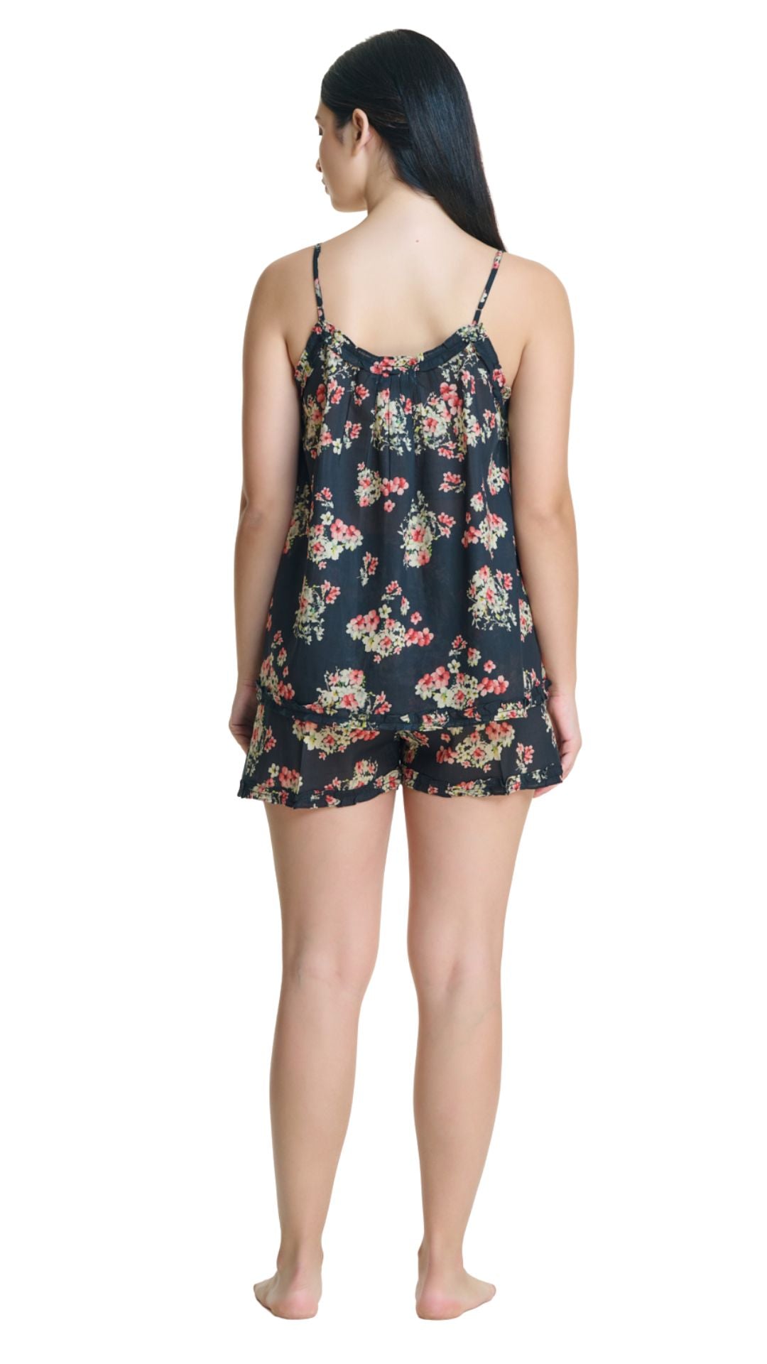 Woman wearing dark floral matching PJ set