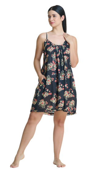 Woman wearing a dark floral nightgown on a white background