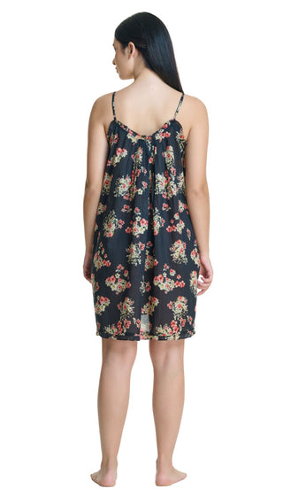 Woman wearing a floral nightgown on a white background