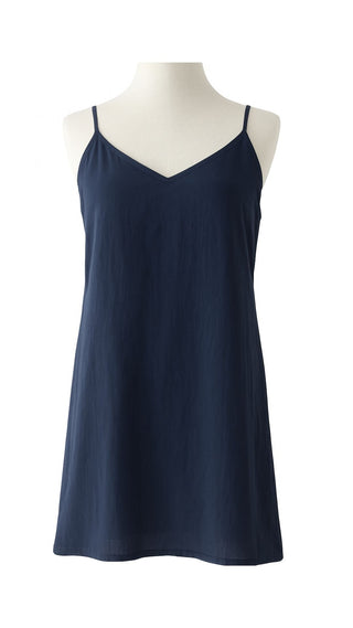 Navy blue slip dress on a mannequin against a white background