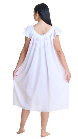 Model wearing plus size white cotton nightgown