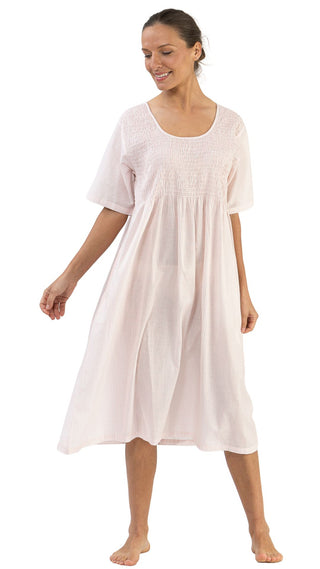 Woman wearing pink gingham cotton short sleeve nightie