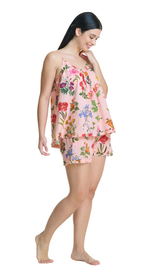 Woman wearing short floral pink matching Pj set